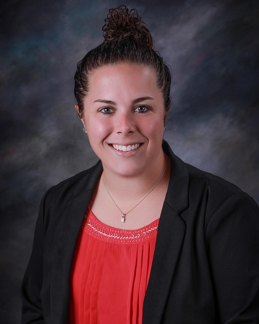 Smiling team member named Elara Vance, looking professional and friendly.